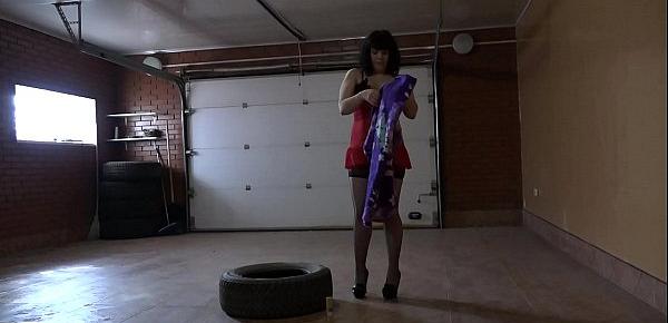  Brunette with a juicy ass doggystyle with a long dildo fucks her anal in the garage of her husband.